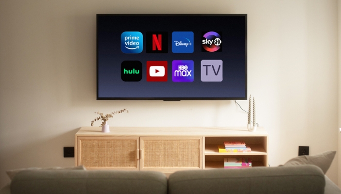 A flat screen TV featuring streaming services on the screen. 
