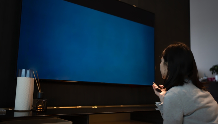 woman watching tv close up