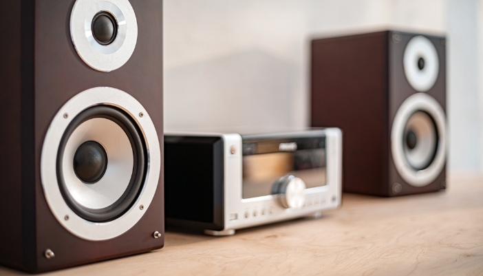 pair of speakers next to receiver