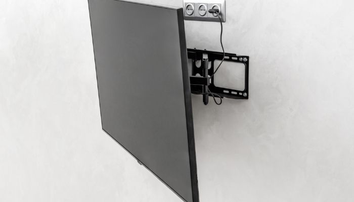 tv mounted on a tilting tv mount