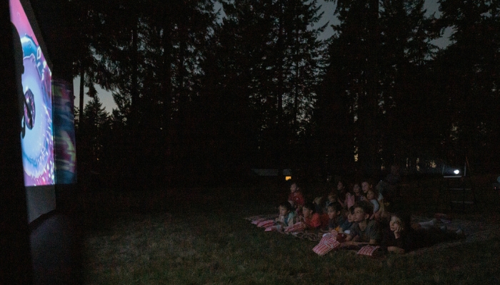 Backyard movie with lots of kids