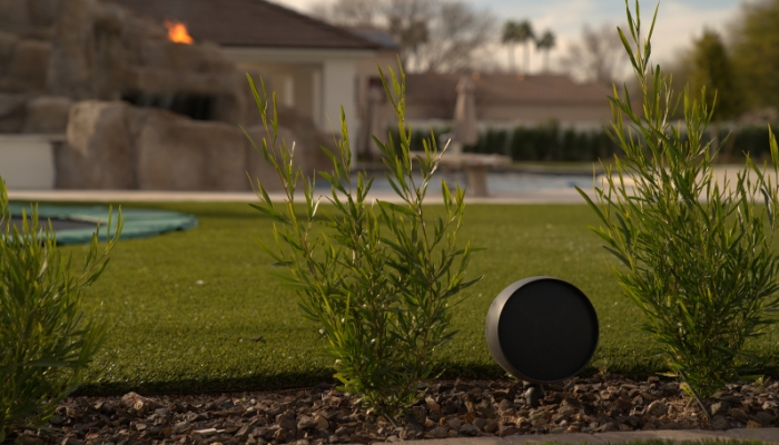 Satellite speaker staked into the landscape