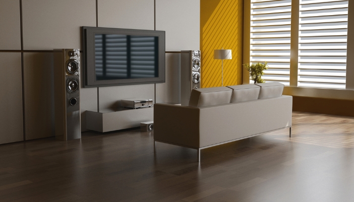 A pair of floor standing speakers in a large room