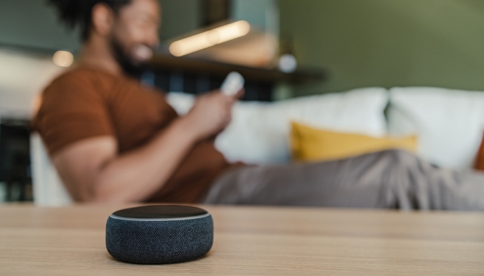 A closeup of a smart speaker waiting for commands