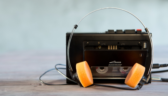 Closeup of a portable cassette player and the attached headphones
