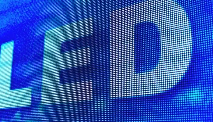 Word “LED” on a blue pixelated background