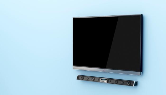 wall-mounted flat screen tv and soundbar