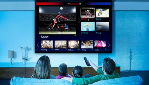 Family Watching TV in Home Theater