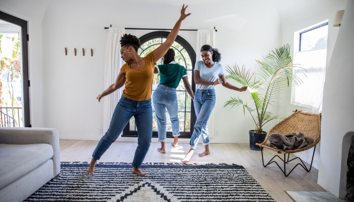 Group of friends dancing to music