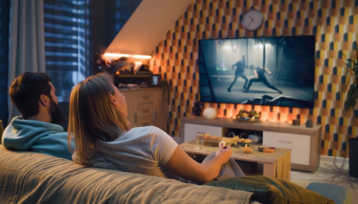 Couple watching action film with decent refresh rate