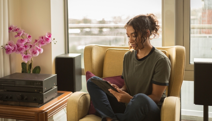 Woman queuing up music on her sound system