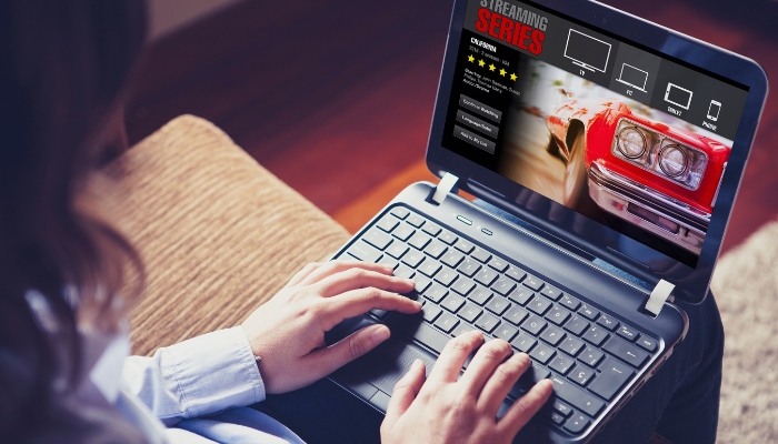 Woman streaming on laptop