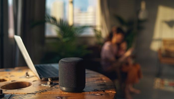 speaker on table with mom in child in back