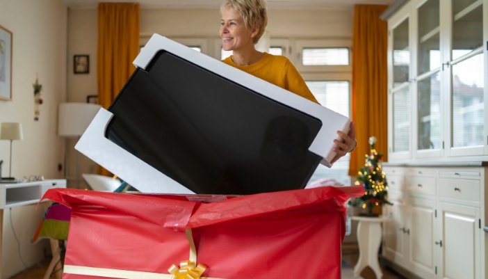 A mom opens a gifted TV