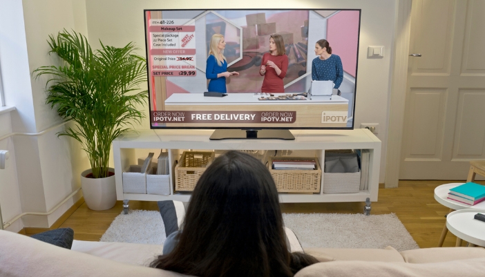 A TV featuring a shopping channel with static images on the screen