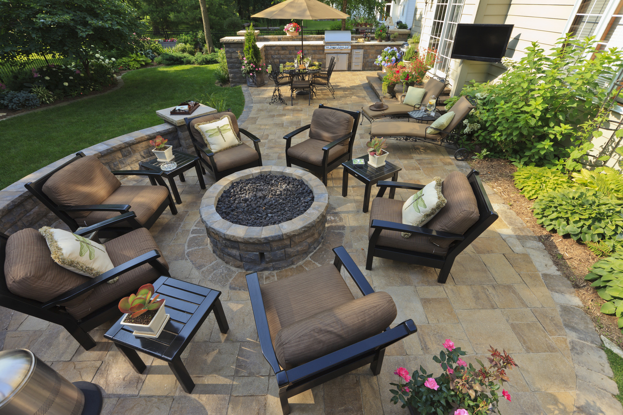 backyard gardens and patio with outdoor tv from an elevated view