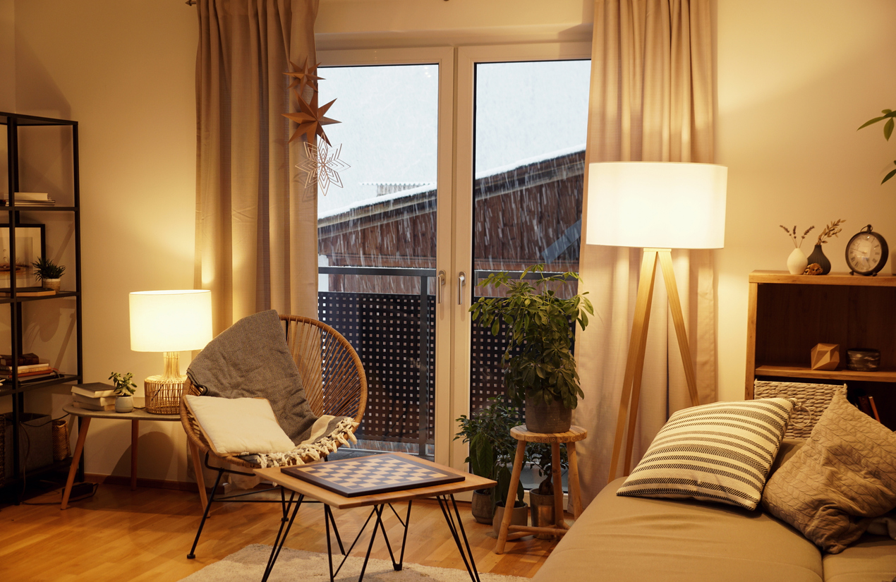 corner lamp illuminates room on a rainy day