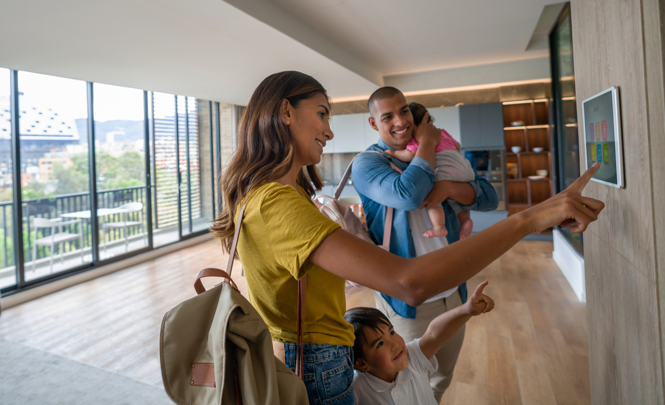 family leaving the house locking the door using automated security system