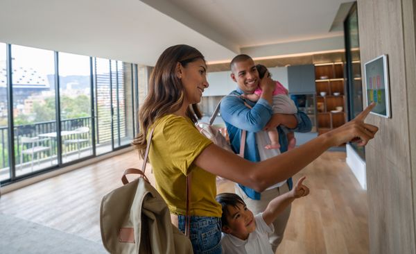 Family Using Smart Home Control Panel