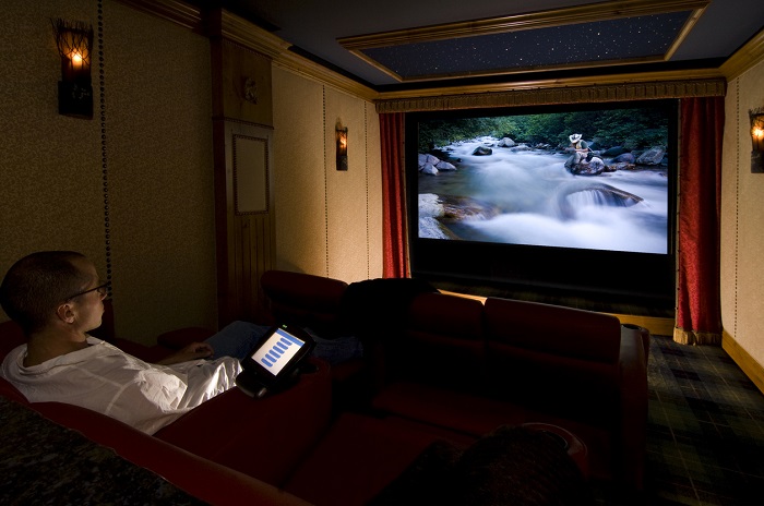 man watching screen in home theater