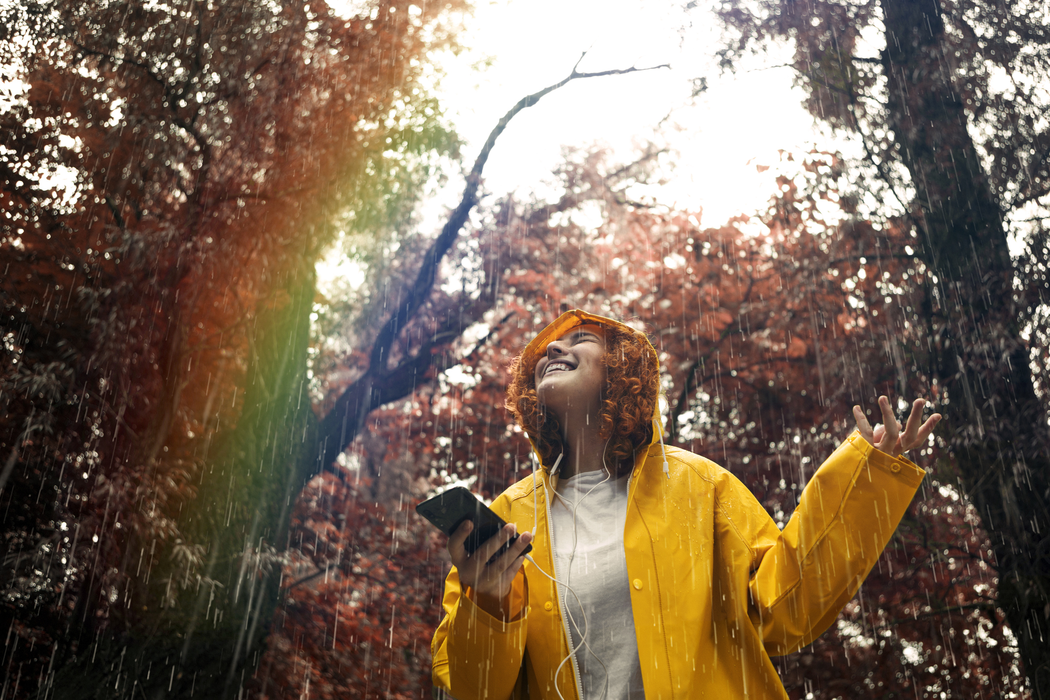 woman listening to music in the rain 