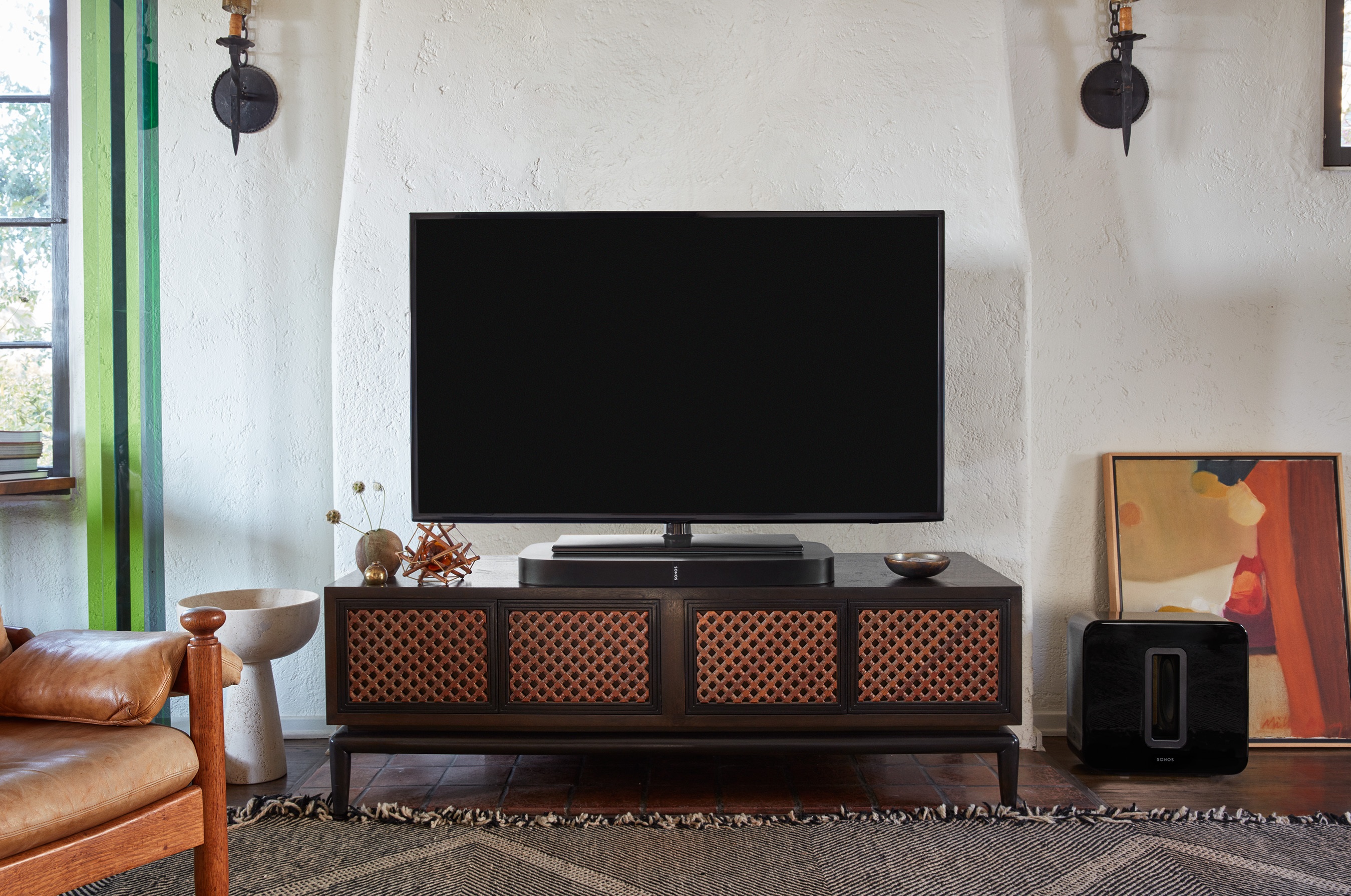 modern home theater setup with Sonos playbase and subwoofer