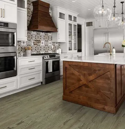 The Shaw Floors Floorte brightened oak hardwood flooring in a kitchen 