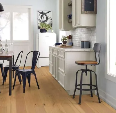 The Shaw Floors Floorte harvest oak hardwood flooring in a kitchen 