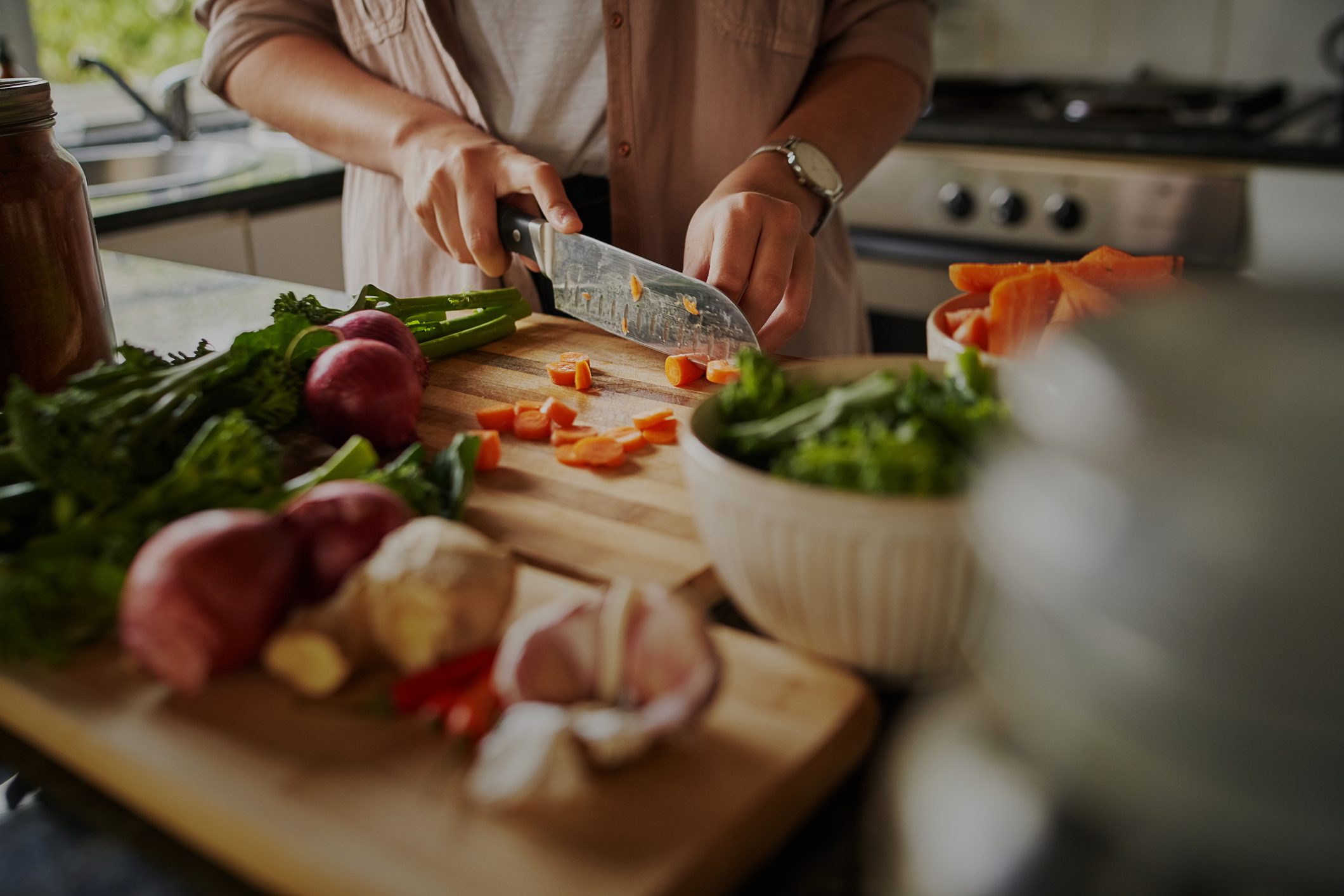 slicing fresh veggies for dinner
