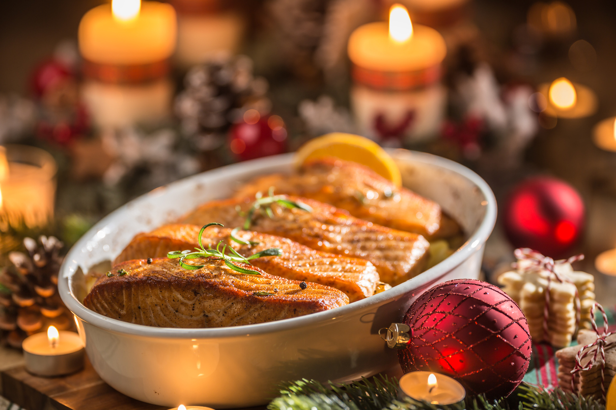 Christmas dinner baked salmon on festive tablescape 