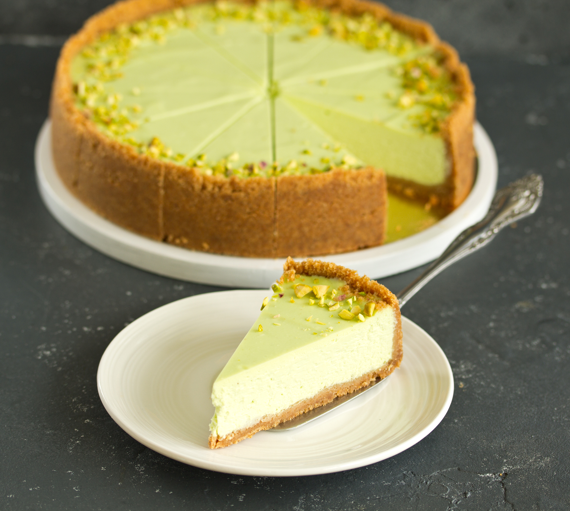 big slice of pistachio cheesecake