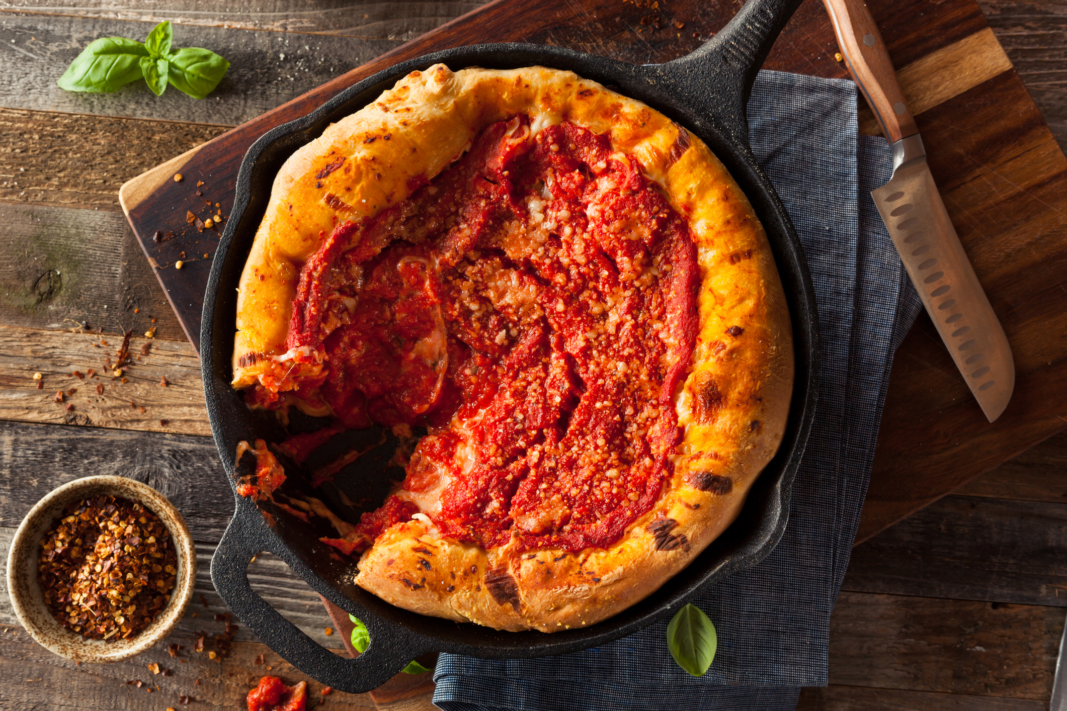 Overhead shot of pizza cooked in a cast iron skillet