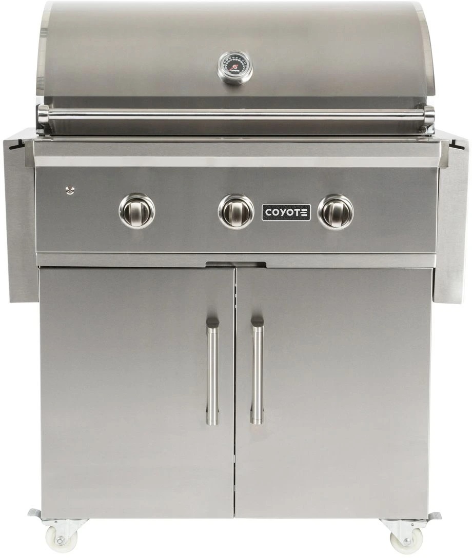 : Stock photo of a stainless steel Coyote built in gas grill with an integrated cart. 