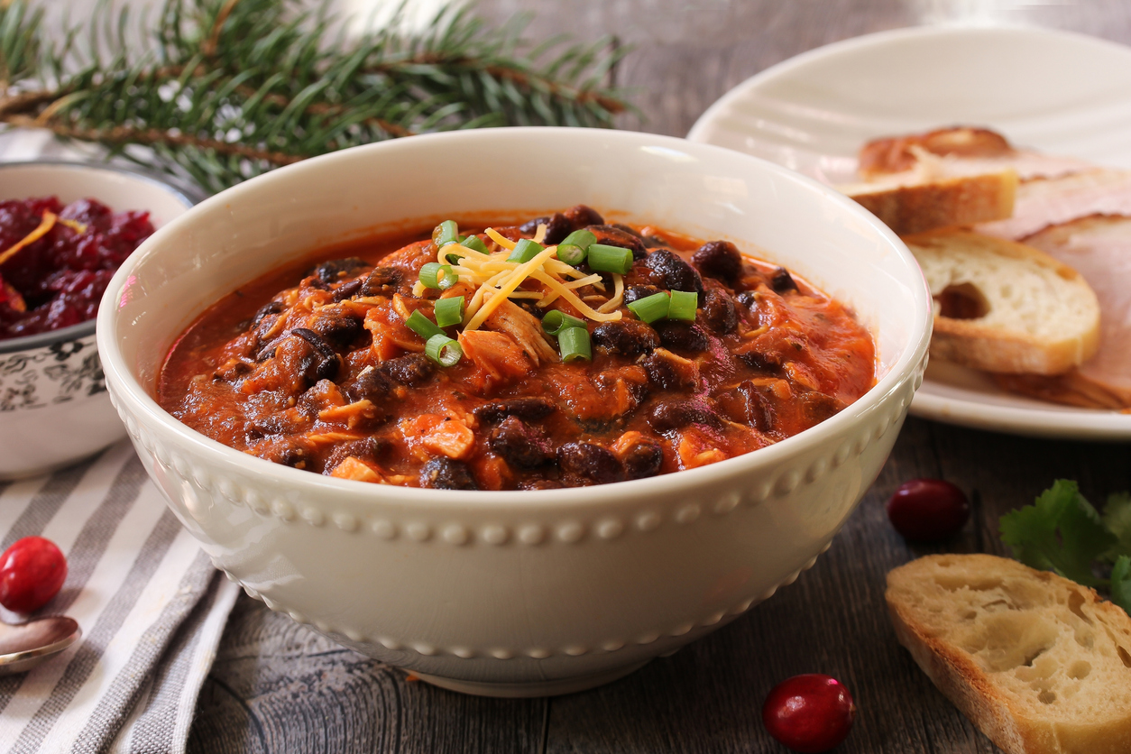 homemade bowl of turkey chili with beans and scallions