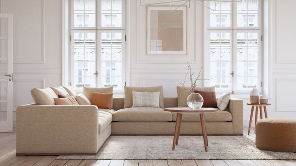 A beige sectional sofa with décor 