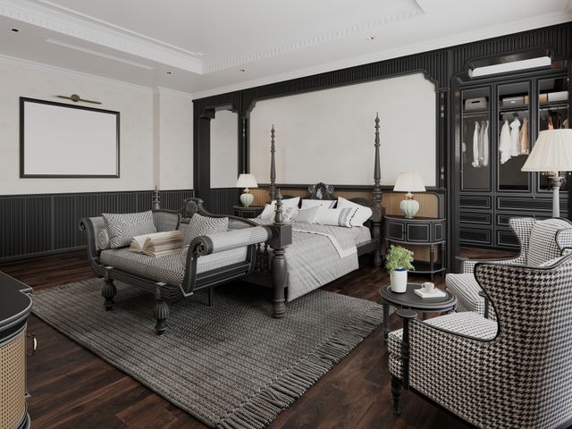Front view of a black and white traditional style bedroom with a poster bed