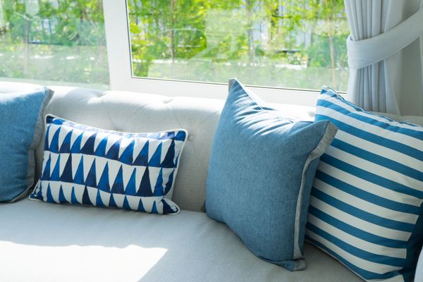 A sofa with blue and white décor 
