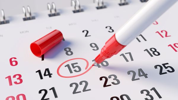 A red marker circling the 15th on a calendar 