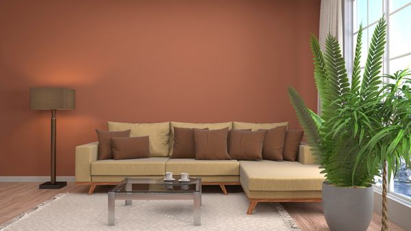 A camel-colored sectional sofa with earth tone décor 