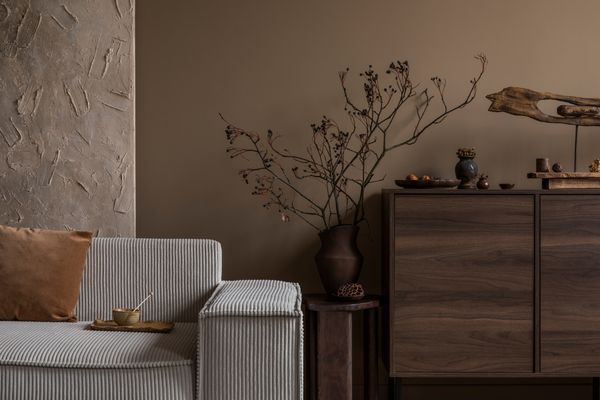 A gray corduroy sofa with décor 