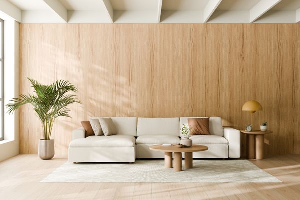 A cream sectional with boho décor 