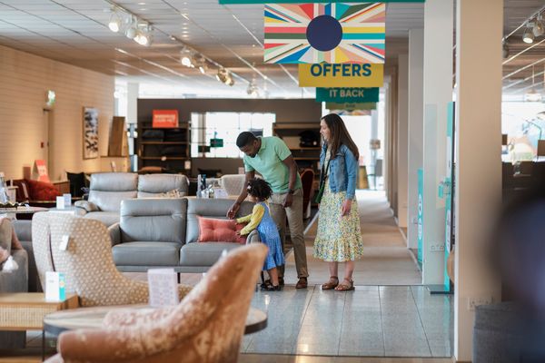 A family shopping for furniture in a store 