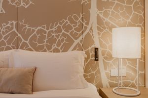 Geometric bedroom wallpaper in tan 