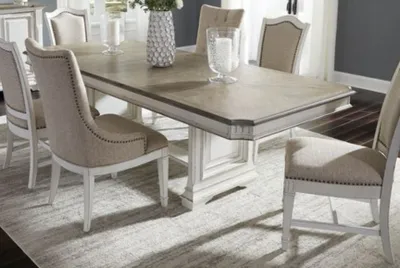 Credit: Liberty Furniture The Liberty Furniture Abbey Park 7-piece dining set in a dining room with décor