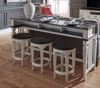 Credit: Liberty Furniture The Liberty Furniture Allyson Park 4-piece console bar set behind a sofa