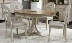 The Liberty Furniture Farmhouse Reimagined pedestal table in a dining room 