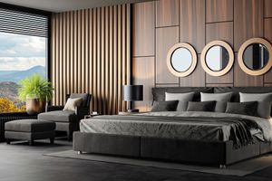 A wide shot of a modern bedroom with décor 