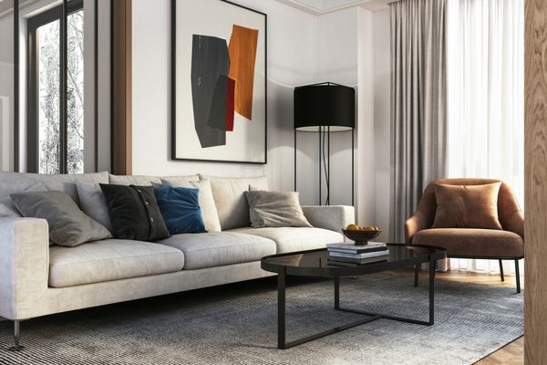 A living room featuring a modern sofa and décor 