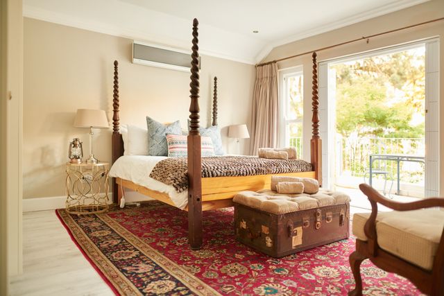 Front view of a modern bedroom with a wooden poster bed