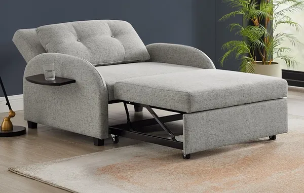 The Powell Home Fashions Augustus sleeper chair in a living room with décor 
